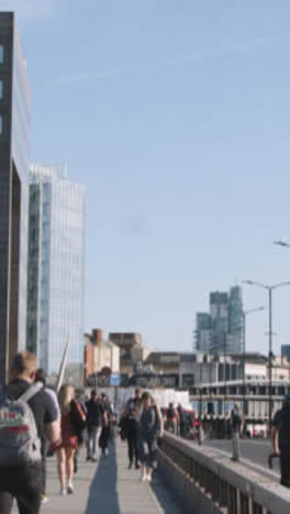 Vertical-Video-Pedestrians-Cyclists-Commuting-London-Bridge-Office-Buildings